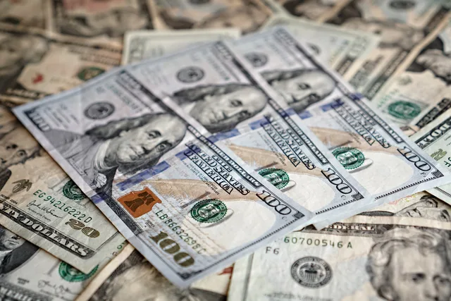 Detailed close-up of various denominations of US dollar bills, emphasizing currency and finance. Which subscription commerce tools and providers fit a UK retailer's stack?